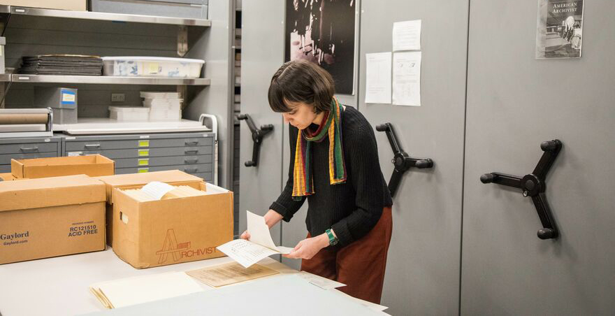 Photograph of Anna working in archives